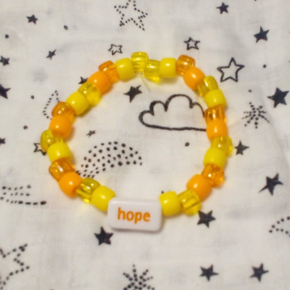 Handmade yellow, orange pony bead bracelet.
